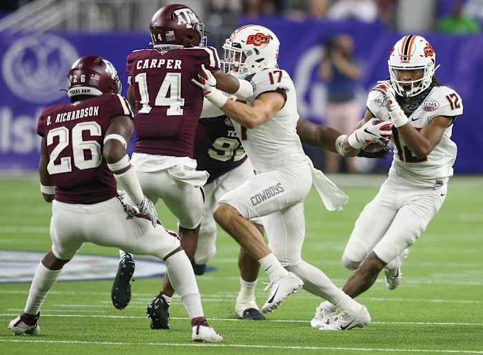 Oklahoma State Cowboys wide receiver Jordan McCray (12) rushes against the Texas A&M Aggies in the fourth quarter at NRG Stadium in 2019.
